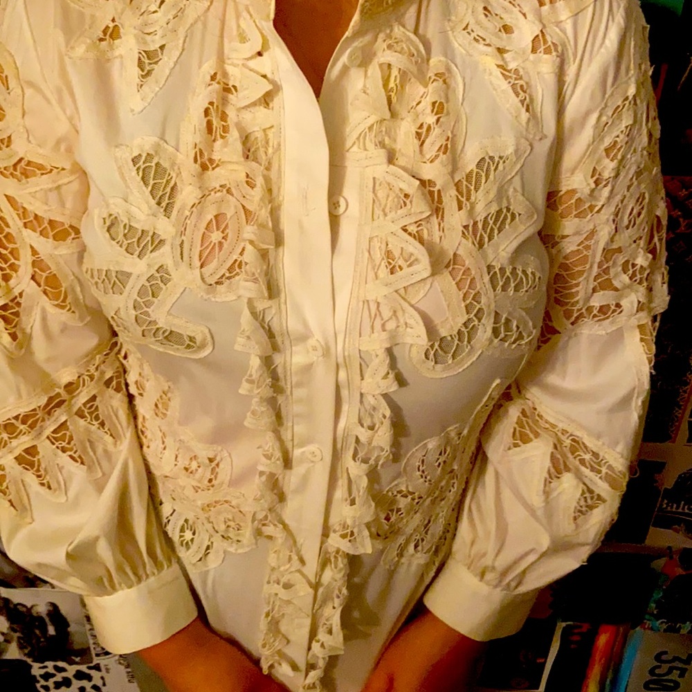 This is a Oscar de la Renta white lace blouse it has been worn several times